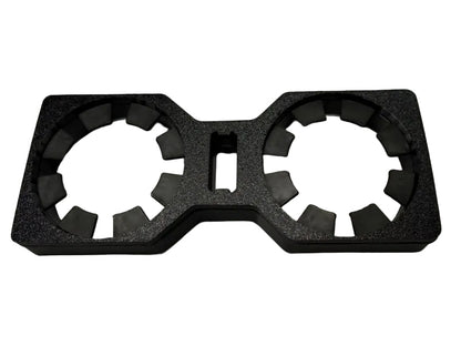 A black textured foam insert with two circular ring-shaped slots and a rectangular cutout in the center, shown on a white background.