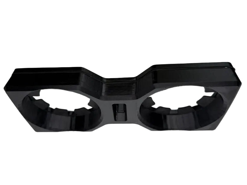 A black plastic 3D-printed accessory with two circular cutouts, shown on a neutral gray background.