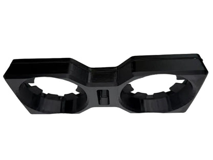 A black plastic 3D-printed accessory with two circular cutouts, shown on a neutral gray background.