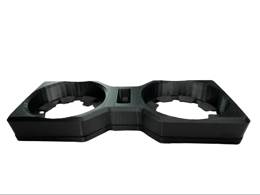 A black 3D-printed dual cup holder tray, displayed on a white surface.